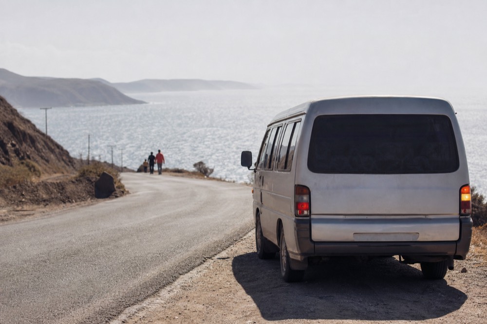 A van waiting on a coastal road outside Ensenada, no text, no logos, no people