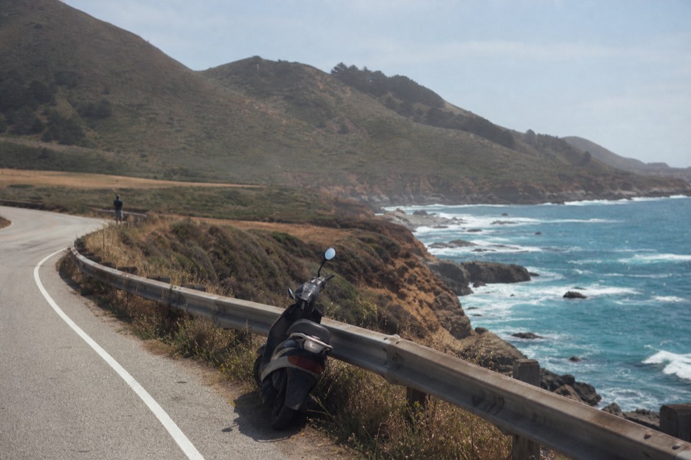 A coastal road with the Pacific ocean and hills near Ensenada, no text, no logos, no people