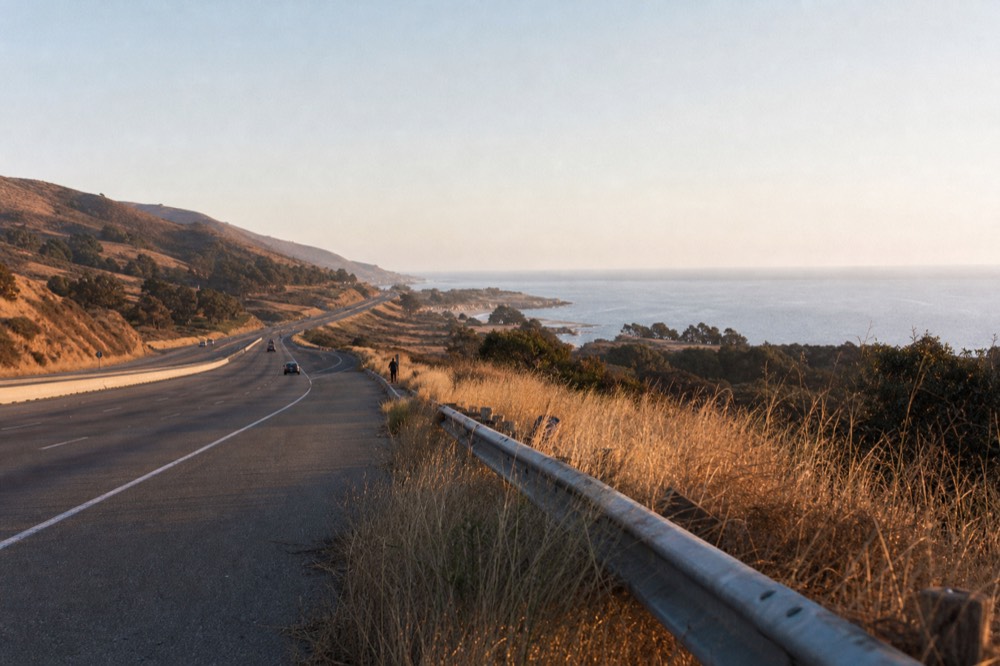 A highway stretching south through coastal hills toward Ensenada, no text, no logos, no people